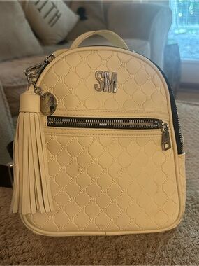 STEVE MADDEN Monogram Cream Mini Backpack with Tassel Charm